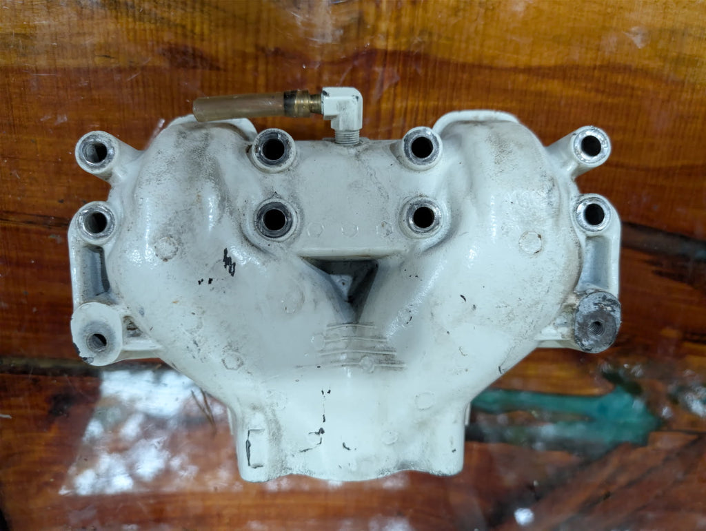 Sea-Doo 717 Rotax exhaust manifold top view showing water ports
