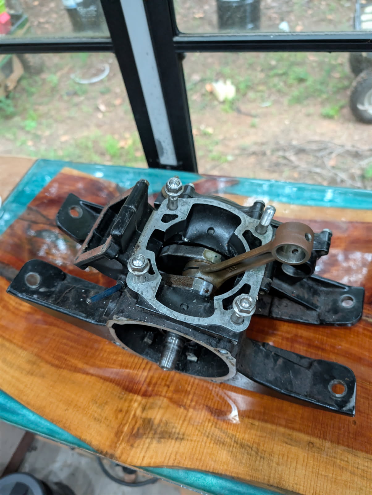 Kawasaki JS300 engine bottom end top view showing crankcase and connecting rod