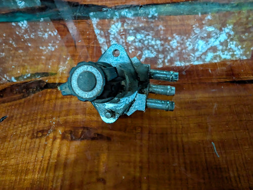 Jet ski fuel selector valve rear view showing diaphragm port and mounting flange