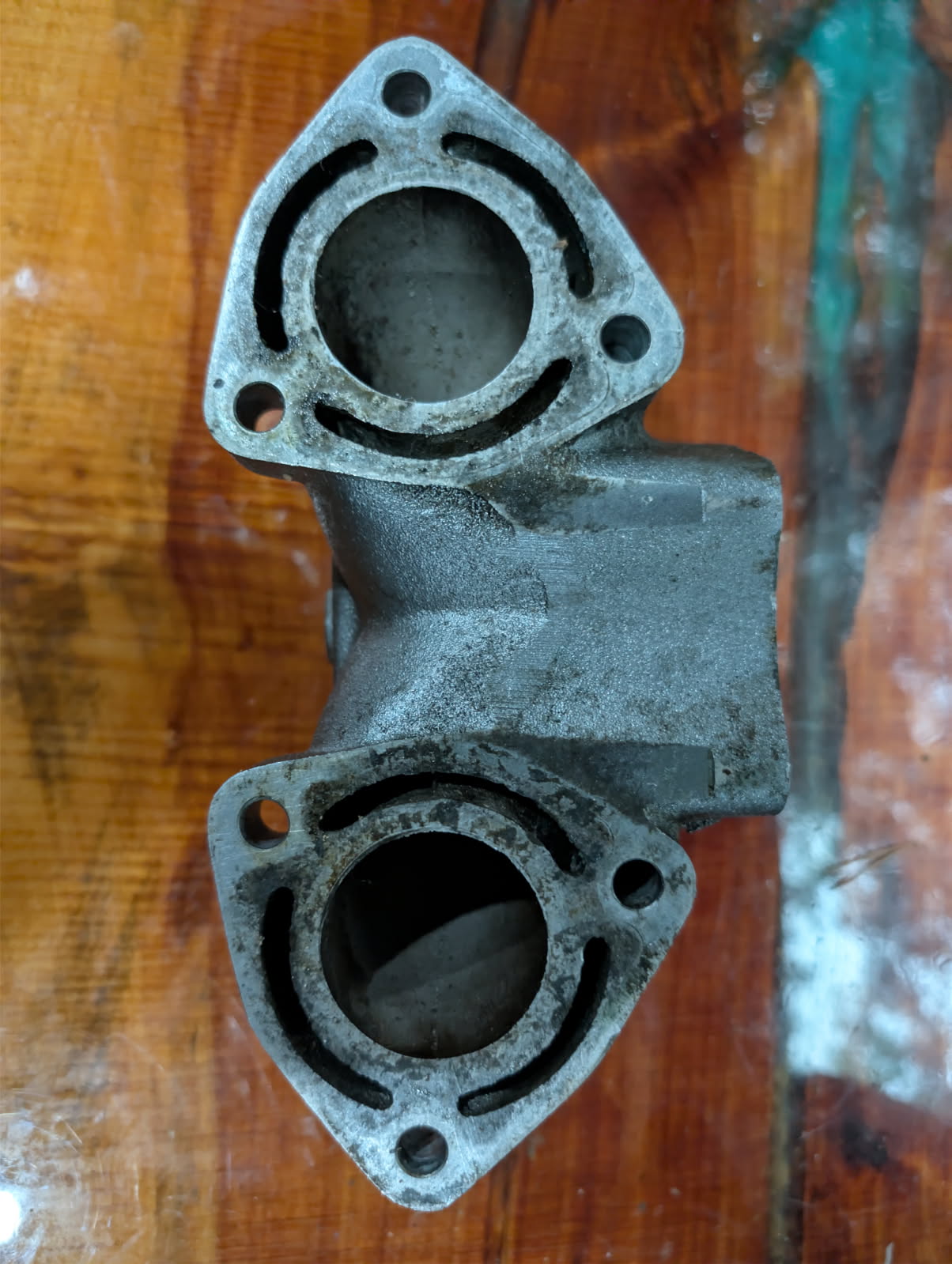 Kawasaki 750 exhaust manifold bottom view showing dual cylinder ports